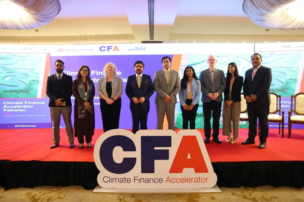 British and Pakistani officials discussing sustainable investment opportunities at the Climate Finance Accelerator event in Karachi.