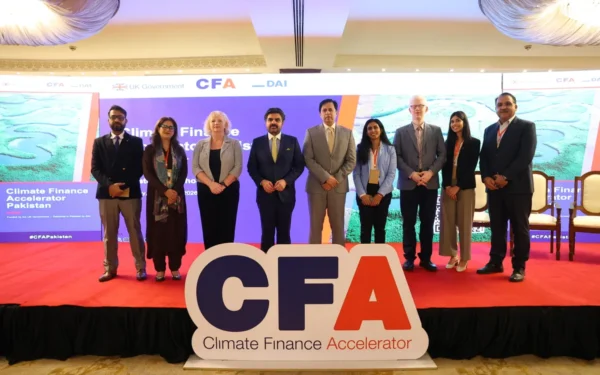 British and Pakistani officials discussing sustainable investment opportunities at the Climate Finance Accelerator event in Karachi.